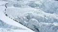 A record number of 274 people scaled Mount Everest via Nepal on Wednesday, after a late start to this year's spring season due to a huge chunk of ice blocking