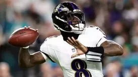 Quarterback Lamar Jackson marked his return from injury by throwing four touchdown passes to help the Baltimore Ravens beat the Miami Dolphins 28-6