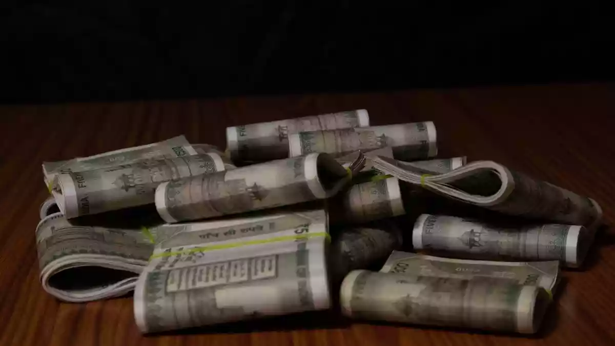 The rupee depreciated 8 paise to 90.98 against the American currency in early trade on Tuesday (January 20, 2026), as strong dollar demand from metal importers