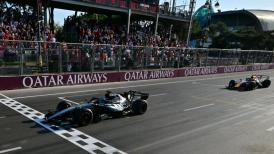 <b>Mercedes' George Russell held off a late challenge from Red Bull's Max Verstappen to win an Azerbaijan Grand Prix enlivened late on by two safety car