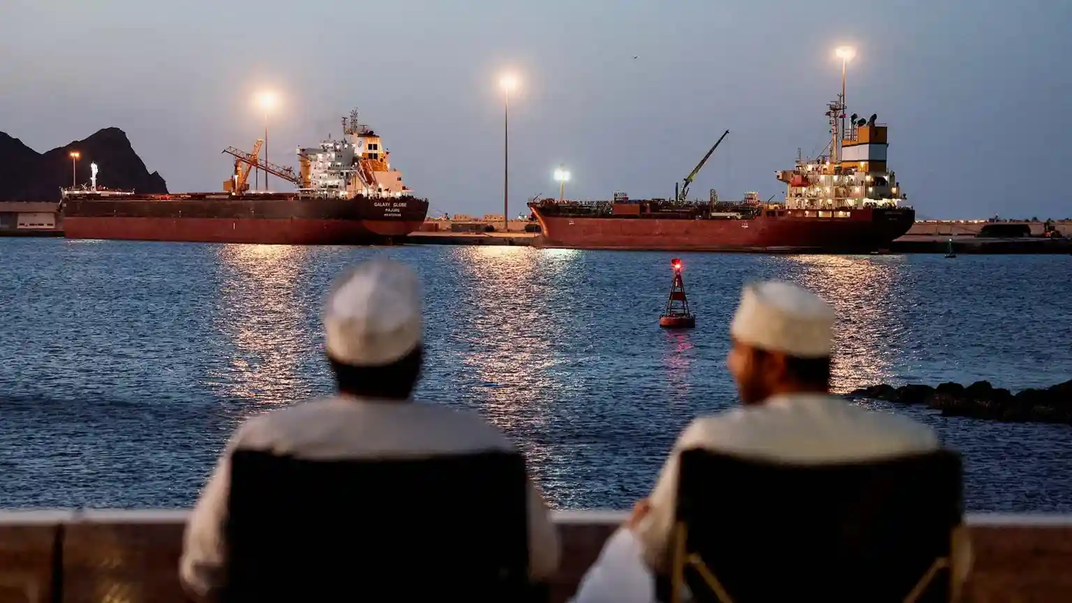 The sea is sometimes so tranquil that Captain Hassan Khan forgets his ship has been stuck in the middle of a war zone for three months