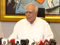 The Supreme Court will hear Kapil Sibal's plea on the Tenth Schedule's interpretation. This plea questions how party mergers allow MLAs and MPs to avoid