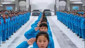 A school in eastern China is facing heavy flak on social media after a video emerged showing students standing at the entrance of the school gate in chilly