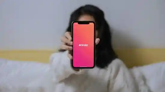 Scrolling through dating apps often brings moments of doubt: Was that charming message real, or was it sent by a bot? Fake profiles and scammers have quietly made their way into India's dating scene, complicating the search for genuine connections. Tinder aims to tackle this issue with a new safety feature designed to verify users and reduce deception.Scrolling through dating apps often brings moments of doubt: Was that charming message real, or was it sent by a bot? Fake profiles and scammers have quietly made their way into India's dating scene, complicating the search for genuine connections. Tinder aims to tackle this issue with a new safety feature designed to verify users and reduce deception.Tinder has introduced Face Check in India, a feature that asks users to take a short video selfie before swiping. The system compares the video to the profile photo, and if it matches, the user receives a blue Photo Verified badge, which shows authenticity to potential matches. The goal is straightforward: ensure that the person behind the profile is real.