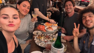 Selena Gomez is celebrating the summer with her fiance, music producer Benny Blanco. On Friday, August 15, the singer and actress posted a series of candid snapshots on Instagram highlighting her favorite summer memories. Among the photos was a cozy moment featuring Gomez, 33, dining outdoors with Blanco, 37, and Logan Lerman, who will appear in the upcoming fifth season of Only Murders in the Building. Lerman's fiancee, artist Analuisa Corrigan, also joined the dinner.