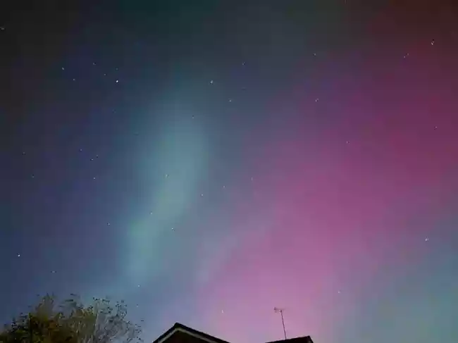 Skywatchers in northern US states and Canada may witness the northern lights on October 1st and 2nd due to ongoing G3 geomagnetic storm conditions. A high-speed solar wind stream is increasing visibility further south than usual, with peak activity expected between 5-8 p.m. EDT. Tips for optimal viewing include dark locations and clear northern views.