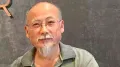 A Chinese dissident who fled his country on a rubber boat has been detained in South Korea after spending 30 hours at sea. Dong Guangping