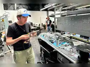 Tech entrepreneur Steven Simoni now leads Allen Control Systems. His company develops the Bullfrog, an AI-powered autonomous machine gun. This weapon shoots drones from the sky. Simoni secured $40 million in funding and U.S. Army contracts. He aims to supply defense products to the government. The company plans further weapon development. Simoni hopes for a public listing next year.