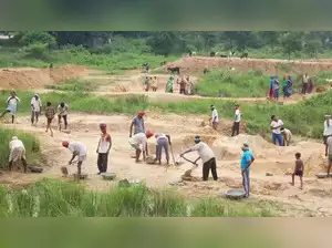 The Congress party criticizes the Modi government for allegedly underfunding MGNREGA, hindering its demand-driven nature. Jairam Ramesh highlights the scheme's 20th anniversary, expressing concern over its future due to budget constraints and delayed payments. The party demands increased funding, a minimum wage of Rs 400 per day, and a halt to exclusionary technologies impacting worker access and payments.