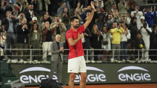 The Serb lost to Jannik Sinner in straight sets in the men’s singles semi-finals at Roland Garros on Friday night Mumbai: Novak Djokovic quickly packed his bags, and then placed it on Court Philippe-Chatrier and applauded the crowd. He blew kisses, tapped his chest, folded his hands, gave the thumbs up. He lifted his bags again and began to walk before stopping again. Bending over, he kissed his hand and tapped the red dirt of Roland Garros.