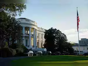 The U.S. government shut down Wednesday amid deep partisan divisions over a funding deal, furloughing 750,000 federal workers and costing $400 million daily. Democrats opposed a short-term bill, seeking extended health benefits, while Republicans threaten further cuts. A highly polarized political climate suggests a prolonged standoff with no clear resolution.