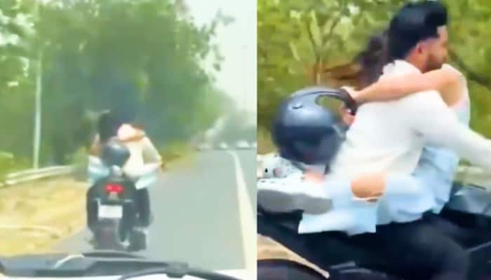 The video, apparently recorded by a passerby, was shared on X by the official account of the Uttar Pradesh Police. The clip has since garnered widespread attention and reactions from netizens. The Uttar Pradesh Police, in a post on the social media platform X, shared a video of a young couple carelessly riding a motorcycle. Neither of them was wearing a helmet, and the girl was seen sitting on the fuel tank, hugging the rider from the front.