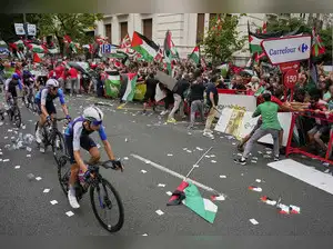 The Vuelta a Espana cycle race faced disruption due to pro-Palestine protests. Demonstrators opposed an Israeli team's participation. The race was stopped, and Jonas Vingegaard was declared the winner. Protesters clashed with police in Madrid. Political figures exchanged accusations. The event highlights the global impact of the Israel-Palestine conflict. Similar protests affected other sporting events in Spain.