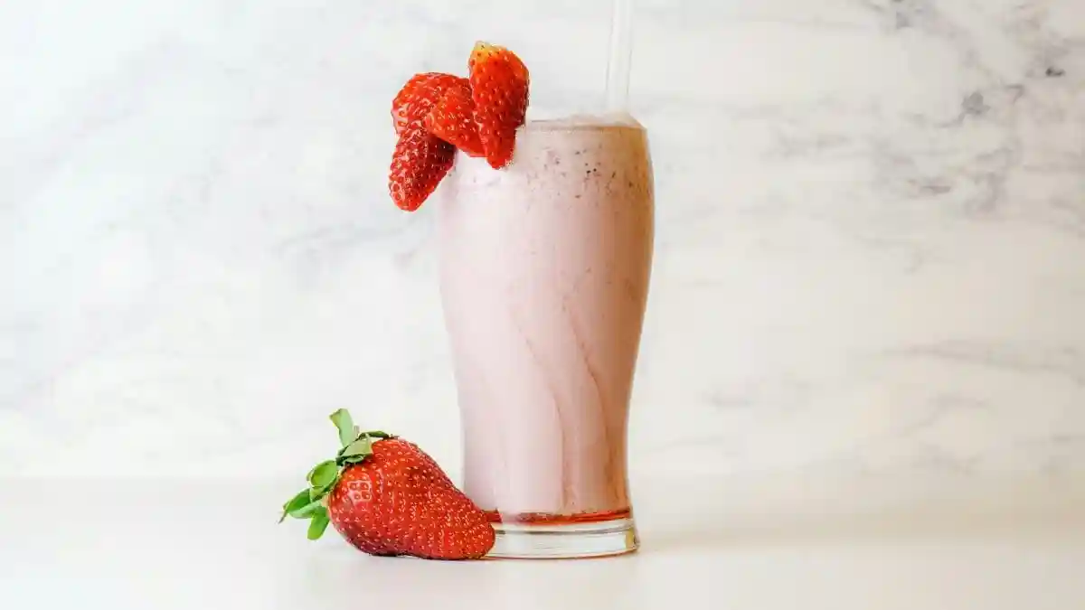 Strawberries burst into season, painting markets red with their juicy sweetness – nature's perfect cue for a creamy strawberry milkshake that captures