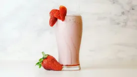 Strawberries burst into season, painting markets red with their juicy sweetness – nature's perfect cue for a creamy strawberry milkshake that captures