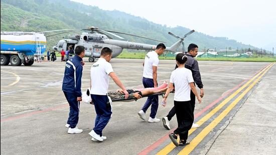 Till reports last came in, there was no trace of the six persons, including a Lt Col and his family, who went missing after a landslide hit an army camp at Chaten in North Sikkim late Sunday evening Kolkata: At least 34 people, including stranded tourists and family members of army personnel, were airlifted from Chaten in North Sikkim and brought to Pakyong on Tuesday, officials said adding that search operations to trace the missing persons continued during the day.