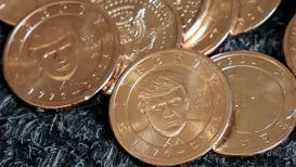 Donald Trump's portrait has made its way on to a US coin - the first time a living president has appeared on American currency in a century