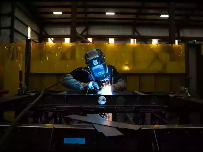 American manufacturing faces challenges due to President Trump's tariffs. Businesses report increased costs and reduced workforces