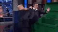 US President Donald Trump has shared an AI-generated video appearing to show him throwing late-night host Stephen Colbert into a dustbin