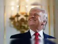 Donald Trump is expected to meet global business leaders in Davos on Wednesday, sources familiar with the matter said, as the US President's presence looms