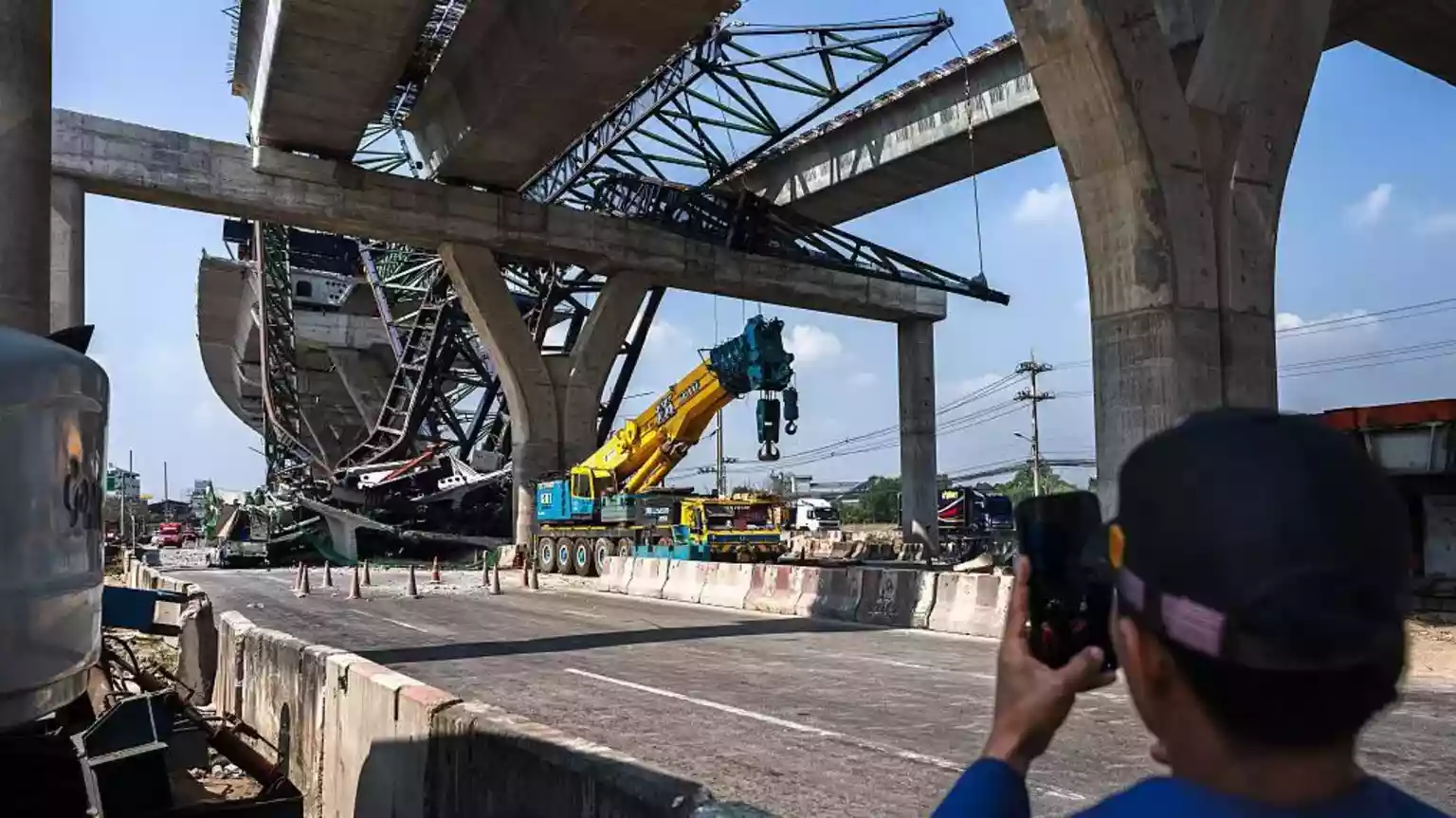 Two people were killed after a construction crane collapsed onto a highway in Thailand, a day after a crane accident in another part of the country left 32