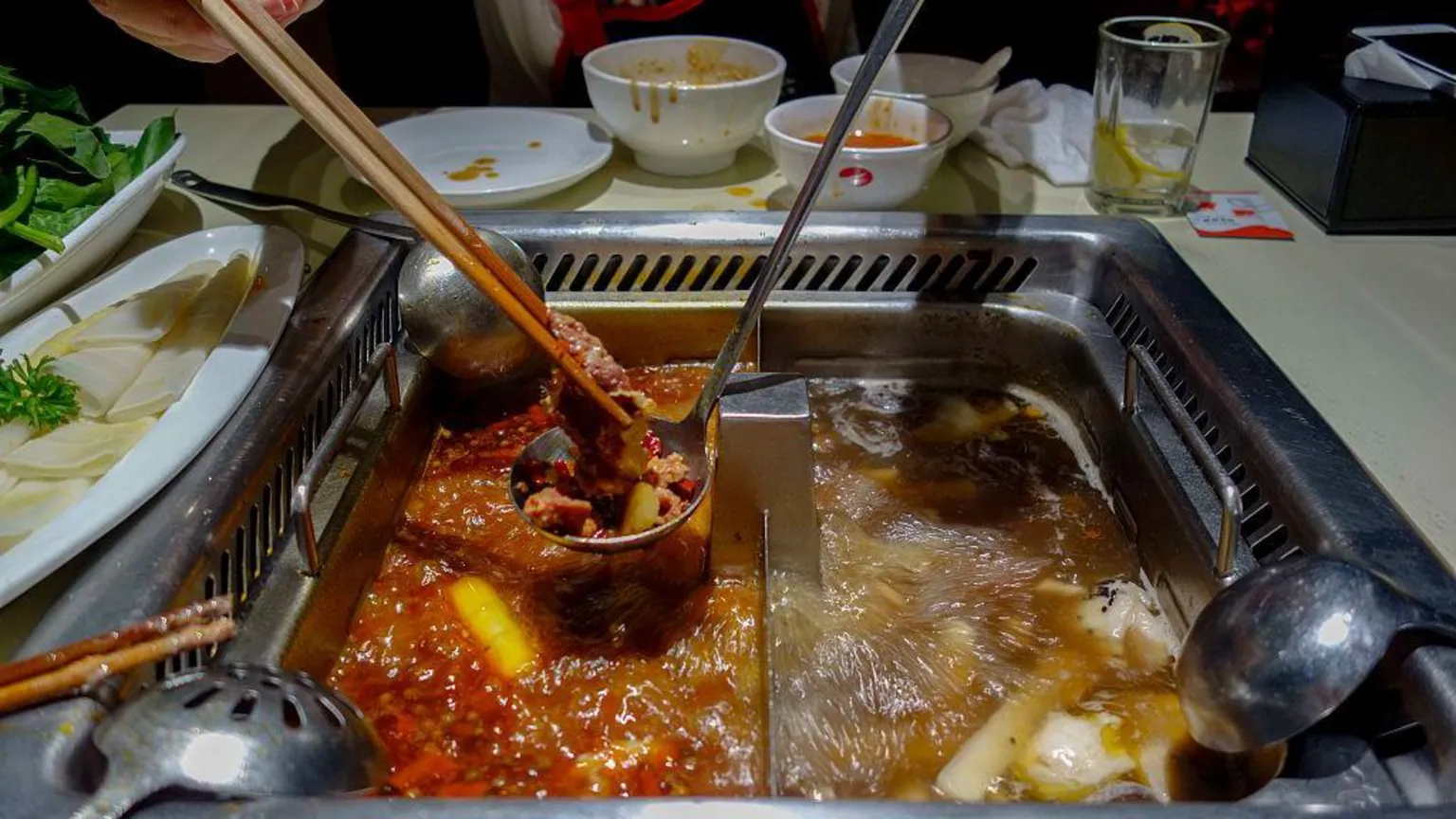 Two teenagers who peed into a pot of broth at a hotpot restaurant have been ordered to pay 2.2m yuan ($309,000; £227,000) to two catering companies in China. The incident, which happened in February at a Shanghai branch of China's biggest hotpot chain Haidilao, sparked widespread criticism after the 17-year-olds posted a video of their drunken act online.