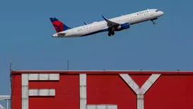 The US transportation department has lifted its emergency order to cut flights across the country, saying enough air traffic controllers are now coming to work