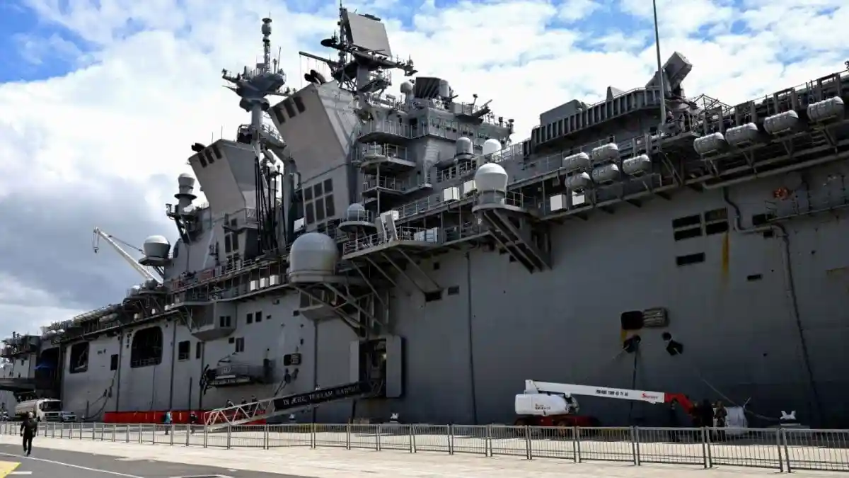 The US Navy’s USS Tripoli, a massive amphibious assault vessel, was tracked off Singapore, possibly carrying thousands of Marines and sailors to West Asia