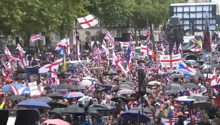 Violence erupted in London when sections of Tommy Robinson's supporters attempted to break through security lines separating them from a rival counter-demonstration organised by 'Stand Up To Racism.' Protesters marched through Central London on Saturday, waving flags of England and Britain. The massive far-right march was led by activist Tommy Robinson. Meanwhile, reportedly, 'Unite the Kingdom' and 'Stand Up To Racism' were the two groups protesting.