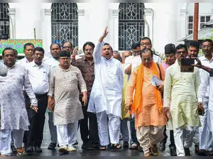 West Bengal Assembly witnessed a tumultuous session as Leader of Opposition Suvendu Adhikari was suspended by Speaker Biman Banerjee for disrupting proceedings during a debate on alleged harassment of Bengali migrants. Adhikari protested Education Minister Bratya Basu's remarks about the Indian Army, leading to slogans and a walkout by BJP legislators. The special session is scheduled to conclude on Thursday.