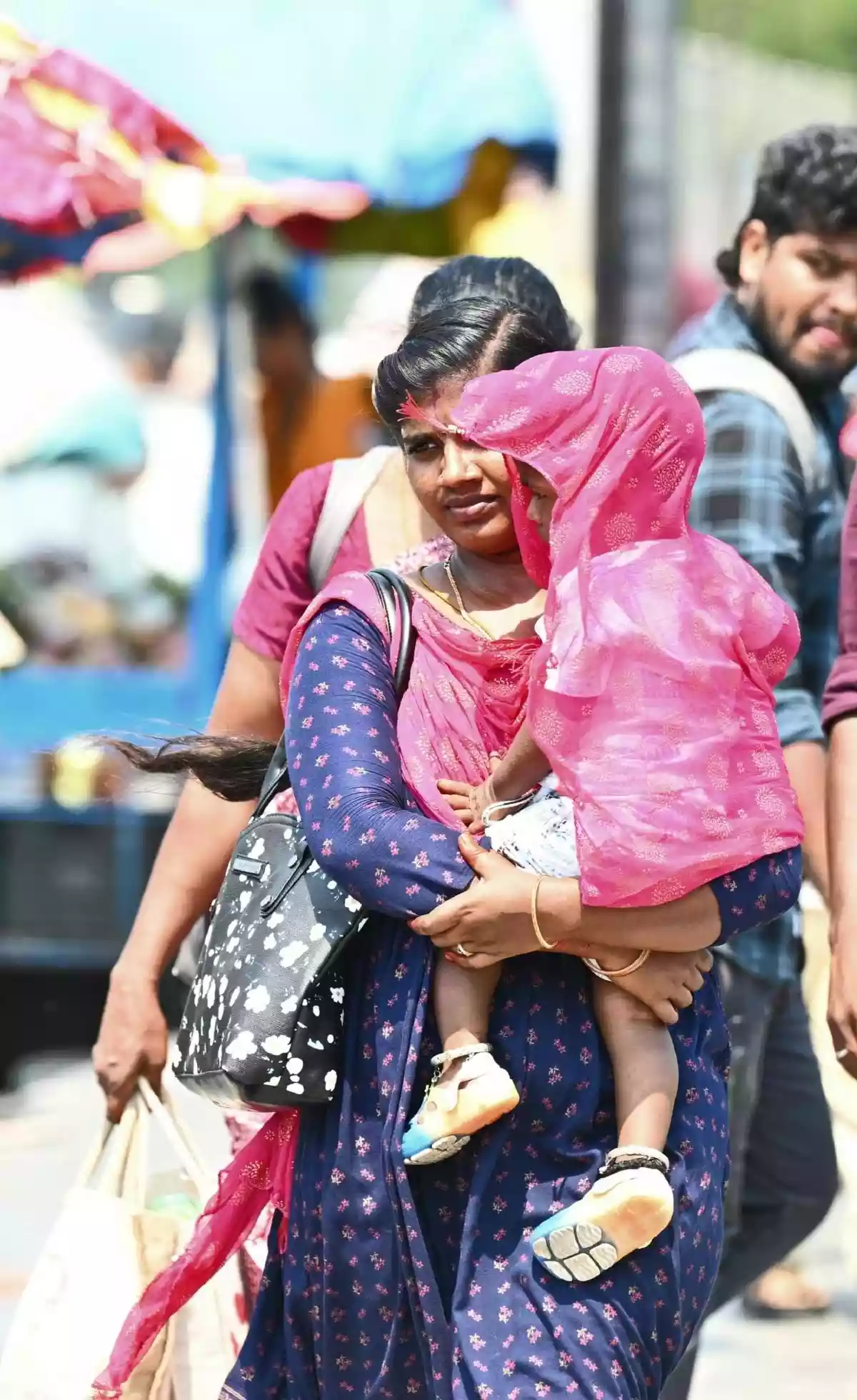 Large commercial complexes, textile shops, and jewellery showrooms blast cold air onto the high street in T. Nagar, Chennai, where the average summer