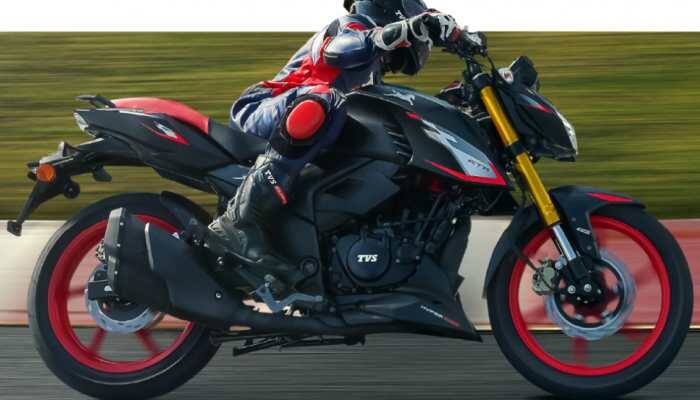 When a bike is moving and you take a turn, the bike naturally leans or tilts. At first glance, it feels like it should topple over, but it doesn't. Why? Let's find out. New Delhi: When a bike is moving and you take a turn, the bike naturally leans or tilts. At first glance, it feels like it should topple over, but it doesn't. Why? Let's find out. The moving bike develops angular momentum, resisting changes to its orientation, and that keeps it upright. When you lean the bike during a turn, gravity tries to pull it down, but at the same time, centrifugal force pushes it outward.