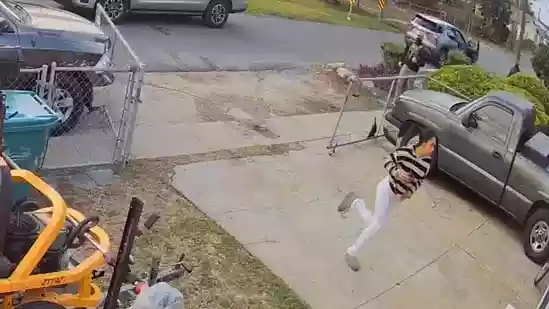 A home-surveillance clip from Marrero, Louisiana, has sparked outrage after showing masked federal agents pursuing a young mother up her driveway during an