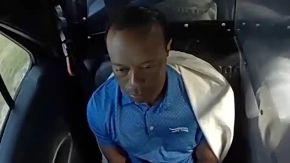 Police have released body camera footage showing Tiger Woods after he clipped a truck and rolled his car in Florida last month.</b> The 15-time major