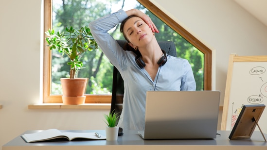 Yoga Day 2025: Stay fit and relieve tension from neck, shoulders and back with the help of simple yoga stretches, no mat needed and at your desk. Yoga Day 2025: On the occasion of International Yoga Day on June 21, let’s take a look at the growing advocacy for incorporating yoga into everyday routines, even at the workplace. The mainstream image of yoga has long been tied to mats and gardens, often leaving out those who struggle to find time for a dedicated practice because of their busy work schedule. But yoga, by nature, is inherently flexible, and with desk yoga stretches, it can easily be integrated into the workday. This way, working professionals can stay energised and stress-free while also maintaining their health by incorporating yoga stretches into their long working hours.